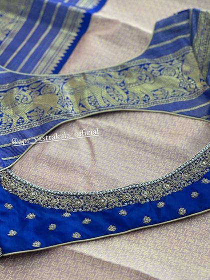 The back of the royal blue blouse, with an elephant motif border.