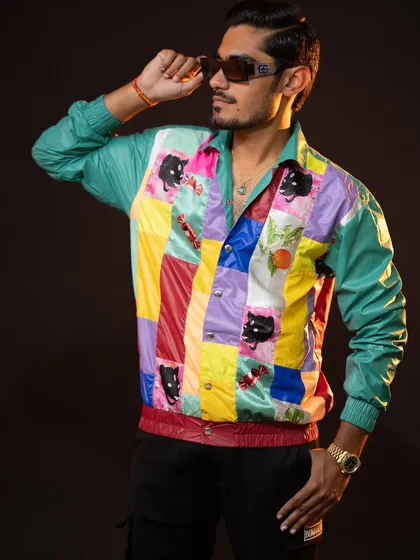 A closer look at the colorful jacket, showing off its unique details. I kept the rest of the outfit simple with black pants to let the jacket be the hero piece.