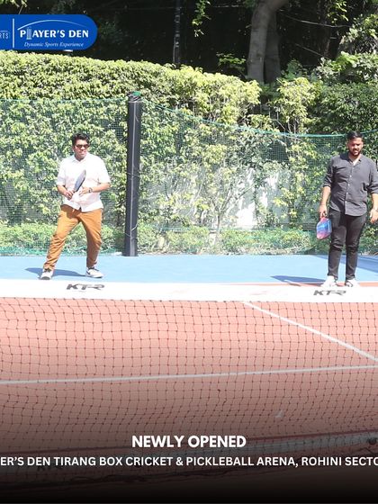 Two players enjoying a game of pickleball on our brand-new courts in Rohini. The smooth, synthetic surface ensures a consistent and true ball bounce.