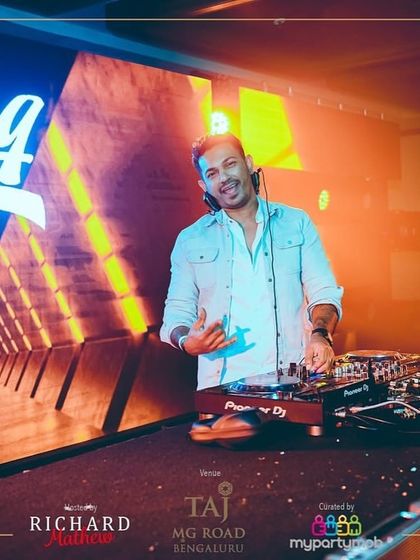 A shot of me at the NYE 2025 event with a futuristic tunnel visual on the screen behind me. The production was top notch.