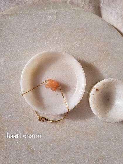 Another view of the Peach Moonstone elephant bracelet, a stone that soothes emotional instability and brings strength.