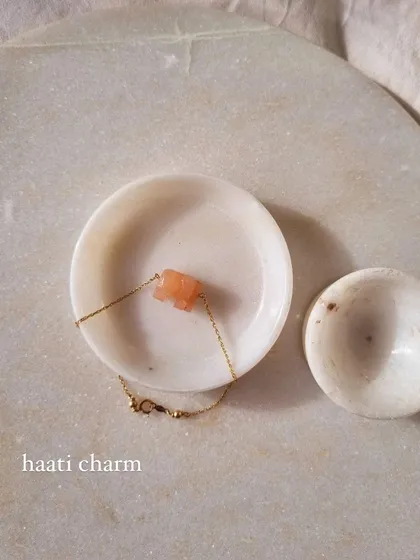 A closer look at the 'haati' charm on my peach moonstone elephant bracelet. This stone is known for promoting inner growth and soothing stress.