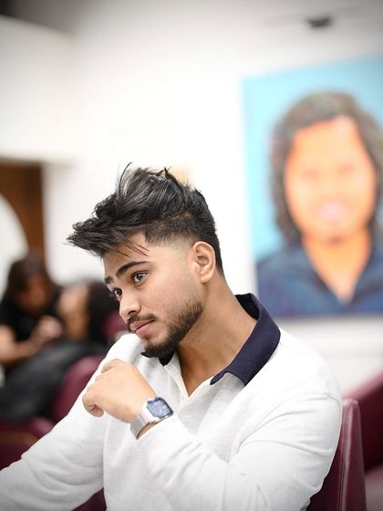 Another shot of the taper fade. The contrast between the short sides and the longer, textured top is what makes this cut so cool.