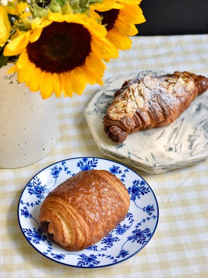 Our weekend viennoiserie specials: a 54% Chocolate Croissant and a Twice-baked Almond Croissant, ready to brighten your morning.