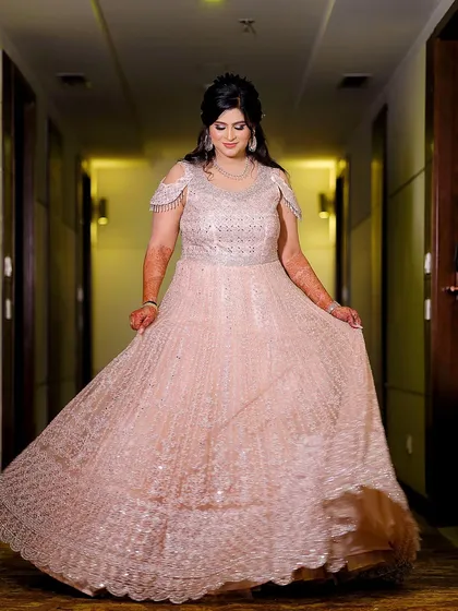 A joyful twirl from the bride in her flowing gown. This action shot shows off the beauty of the dress and the bride's happiness.