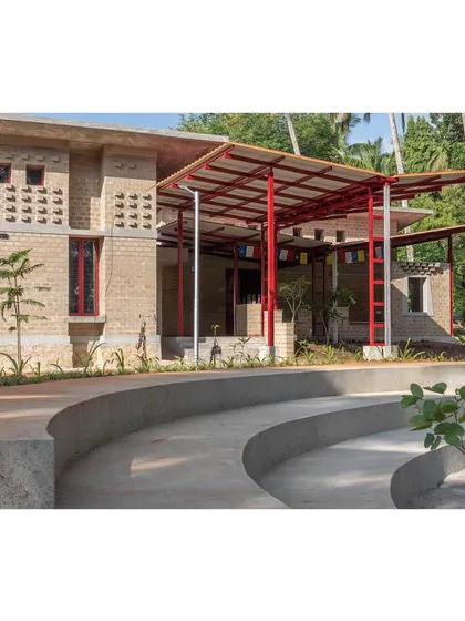 This administrative office for the Tibetan Community in Karnataka is a showcase of our commitment to sustainable, zero-footprint design. The landscape integrates with an edifice built from mud bricks and other local materials, centered around a courtyard that serves as a vital communal space.