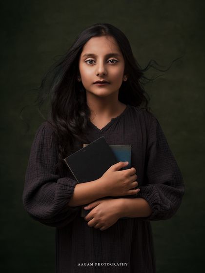 A similar pose from the same session, this portrait captures a quiet and thoughtful moment. The painterly style is perfect for creating timeless kids' portraits.