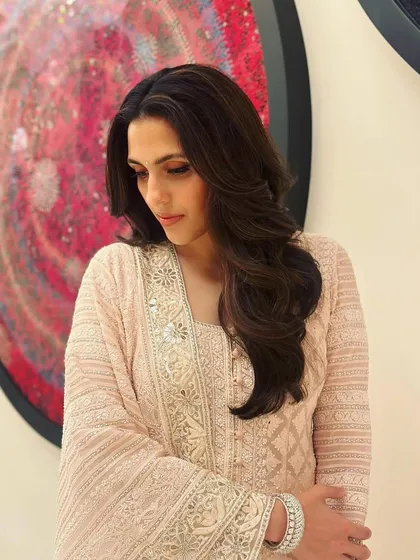 Another angle of the elegant chikankari suit, showing its graceful silhouette and fine detailing.