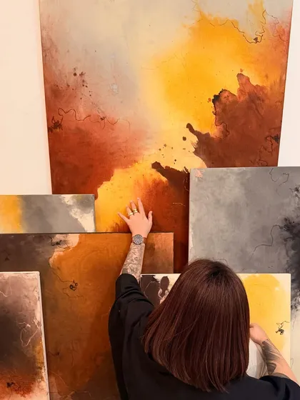 My art is a direct reflection of my soul. Here I am, surrounded by a series of abstract paintings that took months to create. Each piece is a fragment of my emotions, fears, and lived experiences, laid bare on the canvas.