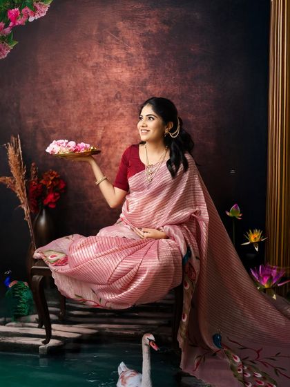 A portrait that feels like a classic painting. Holding a plate of fresh flowers, this expecting mother looks radiant against a backdrop designed to evoke a sense of timeless grace.