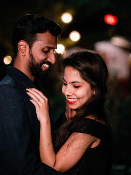 A romantic nighttime portrait with beautiful bokeh from the background lights.