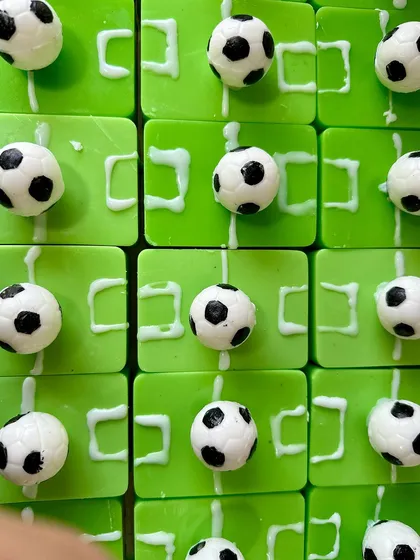 A grid of my handmade football-themed soaps, showcasing the detailed craftsmanship that goes into each bar.