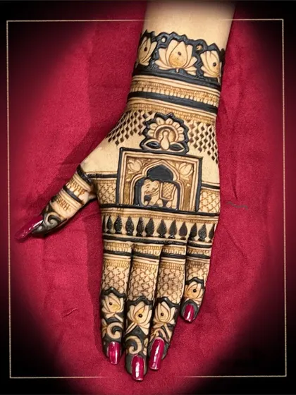 This design is a celebration of traditional Rajasthani motifs, featuring elephants, lotuses, and architectural elements in a rich, dense pattern.