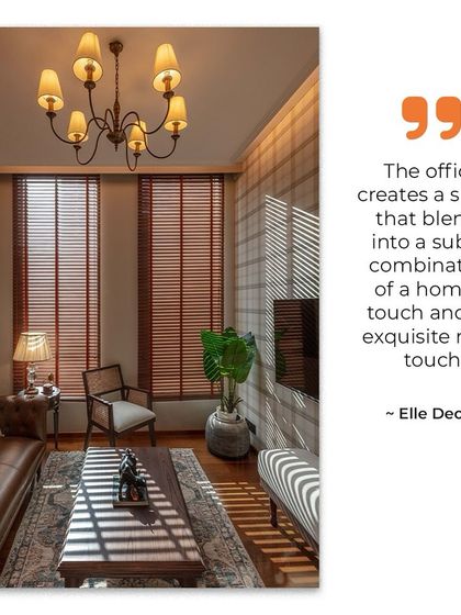 As noted by Elle Decor, this office blends a homely touch with an exquisite royal feel. This lounge area, with its plush sofa and classic chandelier, is a comfortable space for informal meetings or taking a break.