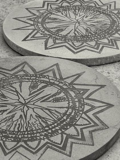 Two of our concrete art tabletops, ready for a project. Each one is a unique canvas, showcasing how we can blend bold creativity with the functional purpose of a table.