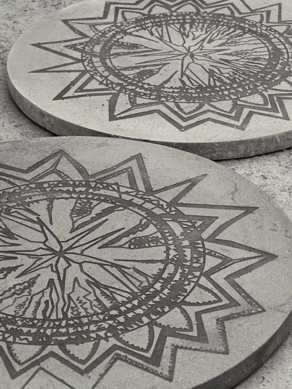 Our Concrete Art Table, featuring beautiful, intricate artwork etched directly onto the concrete tabletop. This piece is for those who want their furniture to tell a unique story.