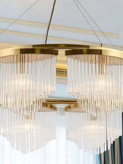A grand chandelier with curtains of glass rods, creating a luxurious waterfall effect. This is an ideal choice for a formal space with high ceilings.