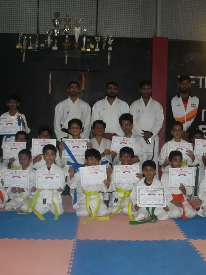 The reward for hard work. Here is a group of my students proudly holding their certificates after a successful belt grading test. Each certificate represents a new level of skill, dedication, and personal growth.