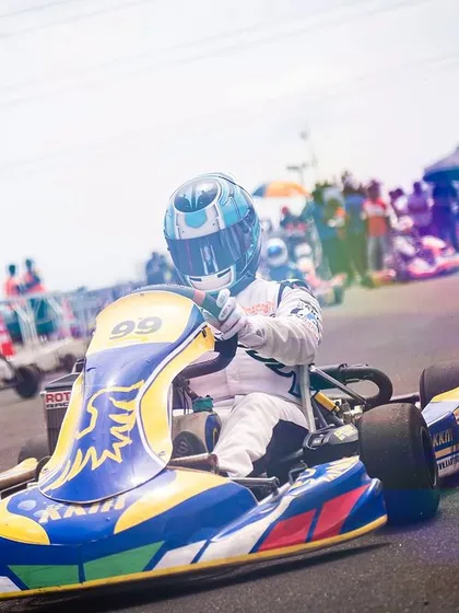 A vibrant, artistic shot of our driver in the number 99 kart during the RMC R3.