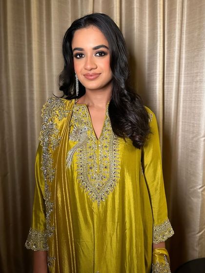 The full look, showing how the smokey eye and a simple, elegant outfit create a look of pure sophistication.