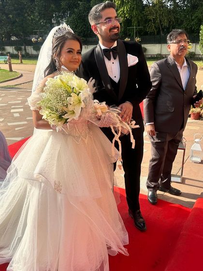 The complete look, from the tiara to the flowing gown. Her makeup is timeless, ensuring these photos will be cherished forever.