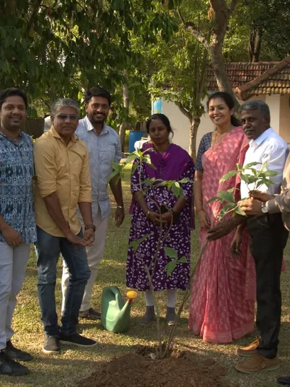 Our team proudly poses with the newly planted sapling on Earth Day. This small act reflects our larger philosophy of nurturing the Earth just as she nurtures us.