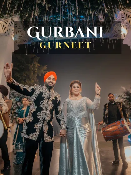 Gurbani and Gurneet make a grand entrance with dhol players. This high-energy shot captures the fun and excitement of a Punjabi celebration.