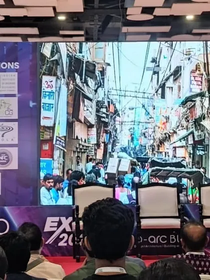 Presenting a keynote at the D-Arc Build Expo, with an image of a dense urban streetscape on the screen behind me. My talks often focus on the potential for community-led revitalization in complex urban environments.