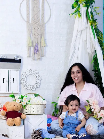A beautiful mother and son moment. The tent setup provides a lovely, contained space for little ones to play and interact naturally while I capture their smiles.