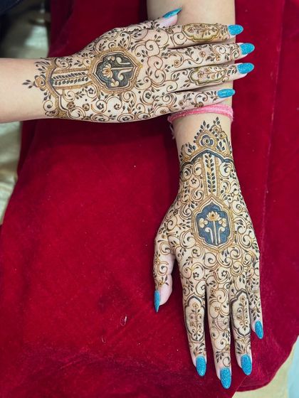 Both hands together, showcasing the beautiful and symmetrical design.