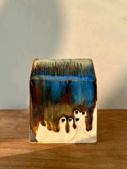 A beautiful example of flowing glazes on one of our miniature house sculptures. Each one is a unique piece of art.