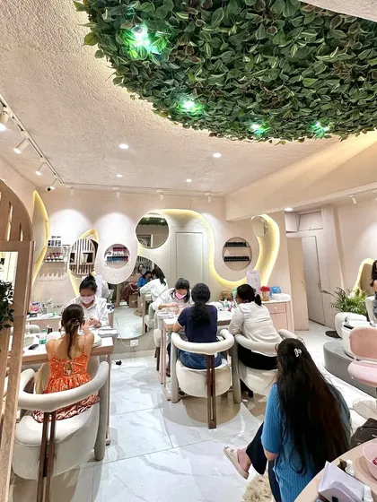 A look at our bustling salon floor. We’ve created a space with a unique aesthetic, from the leafy ceiling decor to the comfy chairs, making your visit a total vibe.