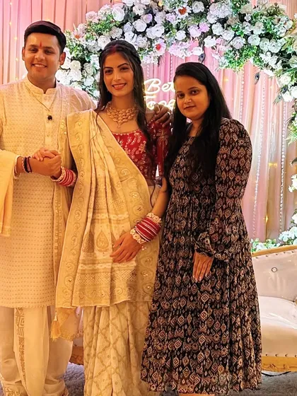 Here I am with the happy couple, Dev Joshi and his wife, at their reception. It's always an honor to be trusted with styling for such important family events.