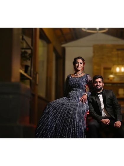 Another stunning portrait of the couple from their reception, showcasing their coordinated outfits and confident poses.
