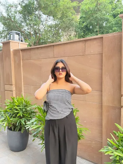 A confident pose in my black and white outfit.