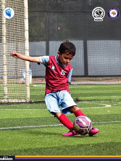 A young player lines up a shot, demonstrating excellent form and technique.