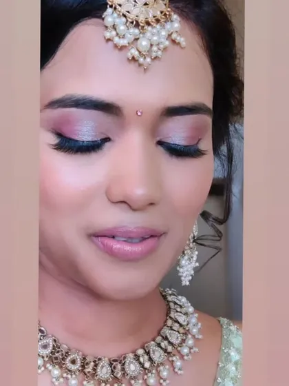A close-up of this beautiful engagement bride's makeup. The shimmery pink eyeshadow and flawless skin give her a romantic, ethereal glow.