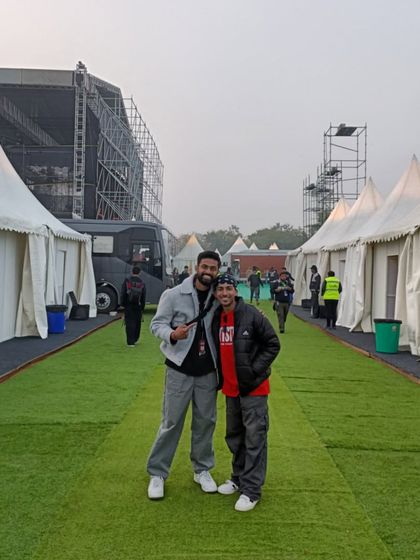 Behind the scenes at the concert. This is the calm before the storm, posing with the crew backstage before hitting the lights. It's all about the journey and the people you share it with.