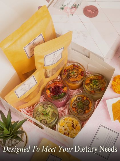 We design our hampers to meet your specific dietary needs. This box is filled with a variety of our fresh dips and crackers, all carefully selected and packed with care.