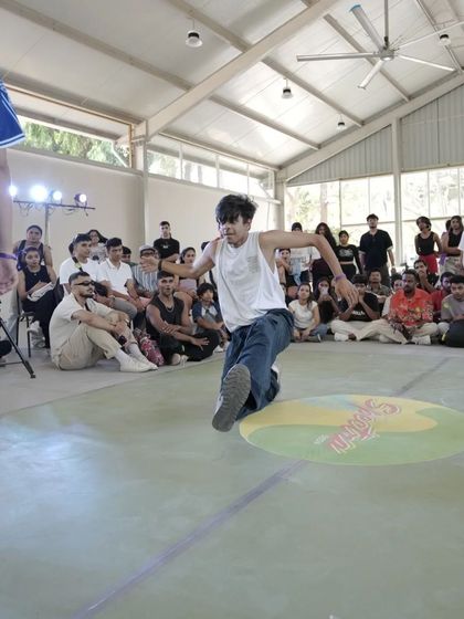 A b-boy hits the floor during a battle at Spectra. Our events celebrate all styles of street dance, from hip hop to breaking.