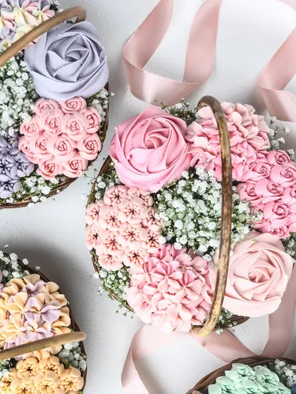 An overhead view of my beautiful floral cupcake baskets, tied with a delicate pink ribbon. Each basket is a unique and stunning edible gift.