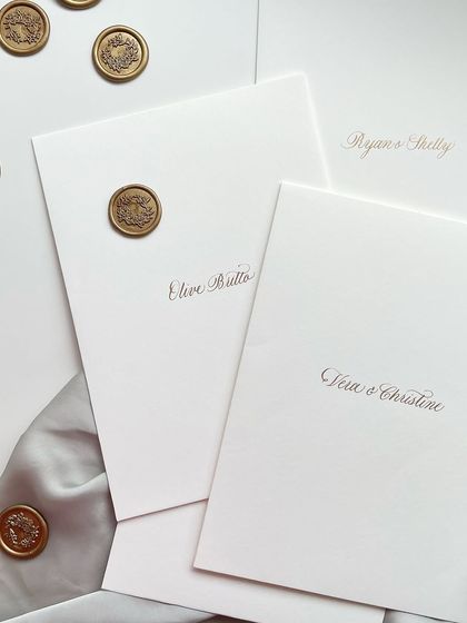 A pair of beautifully addressed envelopes with wax seals. The combination of classic calligraphy and a traditional seal creates a feeling of timeless elegance.
