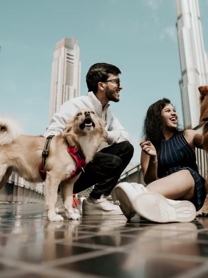 Even pets can be part of the story! A fun and heartwarming shot with the couple and their dogs in Dubai.