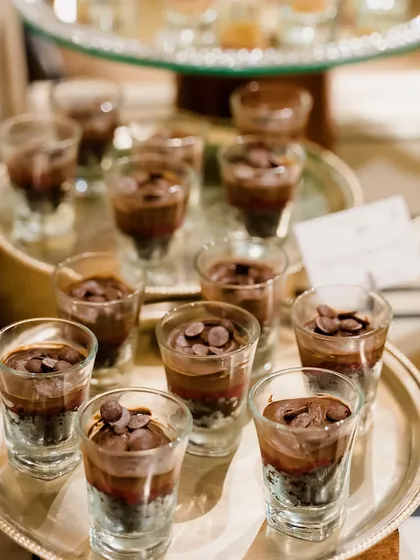 Individual dessert shots of our Belgian Chocolate Dream Cake. The layers of rich chocolate mousse and cake are perfect for satisfying any chocolate craving.