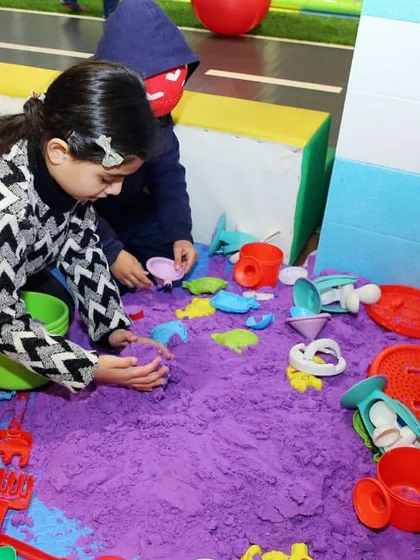 Let their creativity flow in our kinetic sand pit. It's a mess-free way for kids to build, mold, and play.
