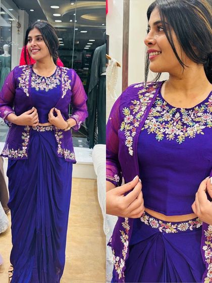 This purple drape saree with an organza shrug is a complete look in itself. The floral embroidery on the shrug adds a delicate and feminine touch.