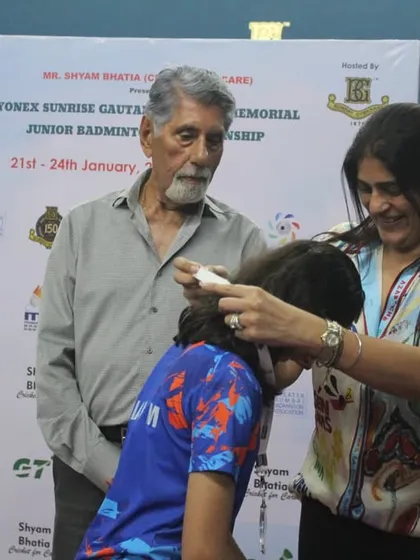 Our director, Supriya Devgun, presents a medal to a young winner, with sports legends looking on. This reflects our hands-on approach to event management and our connection to the sports community.