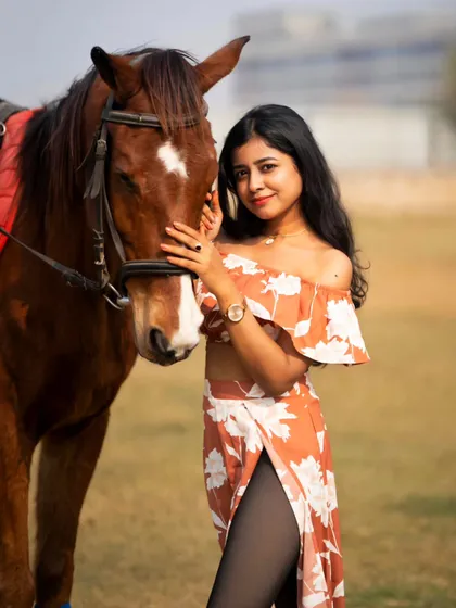 Another angle from the floral dress shoot, showing a warm and friendly interaction between the model and the horse.