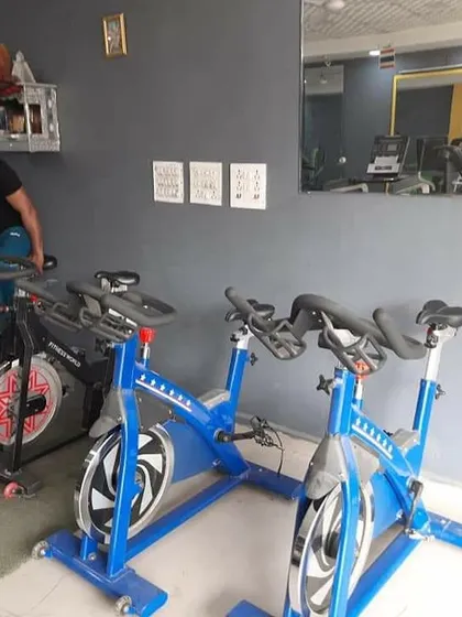 Our cardio section includes these sturdy spin bikes. They are perfect for warming up, cooling down, or for a dedicated high-intensity cardio session to improve your cardiovascular health.