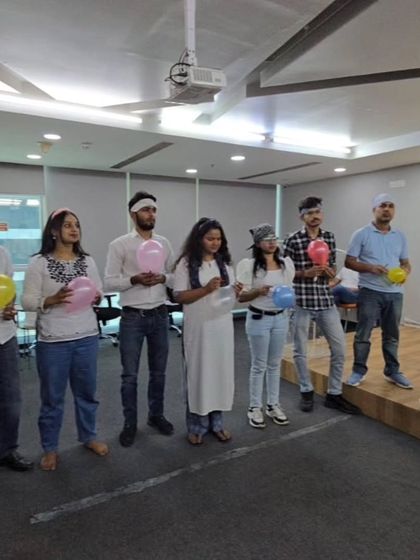 A moment of focus during a balloon activity at our real estate client's workshop. These simple games are powerful tools for teaching communication, trust, and the importance of working together towards a common goal.